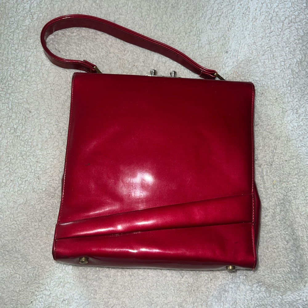 brené red bag with gold detailing
